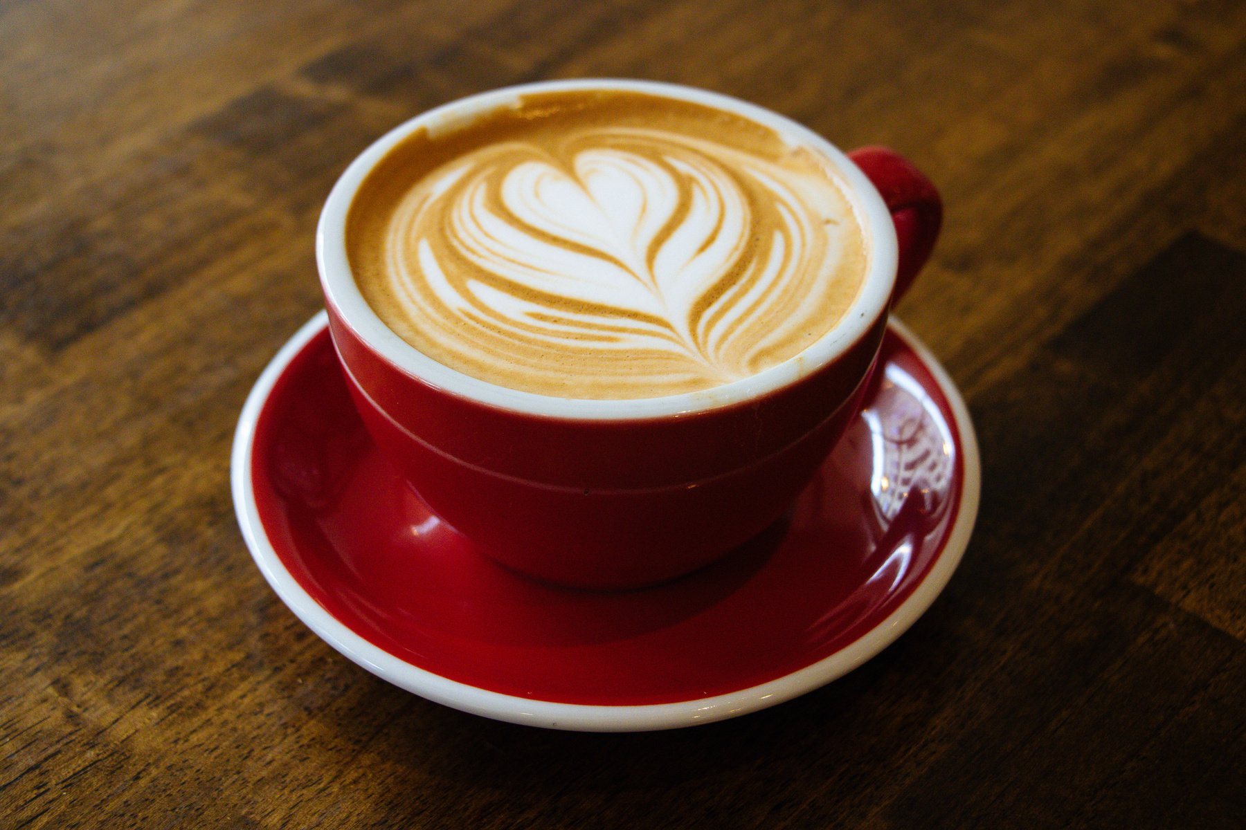 Cappuccino-filled Cup on Red Saucer